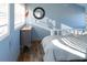 Bright bedroom with wood floors, window seating, and a tranquil blue wall at 3611 Yacht Club Rd # B, Edisto Island, SC 29438