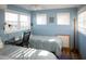 Bedroom with two twin beds, desk, and ocean view at 3611 Yacht Club Rd # B, Edisto Island, SC 29438