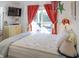 Comfortable bedroom with a queen-size bed and access to a balcony at 3611 Yacht Club Rd # B, Edisto Island, SC 29438