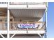 Deck with railing and Edisto Pia sign at 3611 Yacht Club Rd # B, Edisto Island, SC 29438