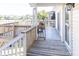 Spacious deck overlooking the water with wooden furniture at 3611 Yacht Club Rd # B, Edisto Island, SC 29438