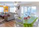 Dining area with a white table, green tablecloth, and access to the living room at 3611 Yacht Club Rd # B, Edisto Island, SC 29438