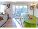Dining room with green tablecloth and access to a deck at 3611 Yacht Club Rd # B, Edisto Island, SC 29438