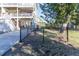 Black chain link fence around the yard at 3611 Yacht Club Rd # B, Edisto Island, SC 29438