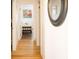 Long hallway with light walls and hardwood floors at 3611 Yacht Club Rd # B, Edisto Island, SC 29438
