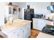 White kitchen with an island, and stainless steel appliances at 3611 Yacht Club Rd # B, Edisto Island, SC 29438