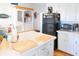 White kitchen with an island, and stainless steel appliances at 3611 Yacht Club Rd # B, Edisto Island, SC 29438