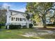 White two story house with sunroom and detached garage at 366 Stringer Aly, Mount Pleasant, SC 29464