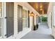 Charming front porch with gray floor and dark shutters at 39 Isle Of Hope Rd, Mount Pleasant, SC 29464