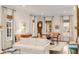 Living room with white sofa, hardwood floors, and large windows at 39 Isle Of Hope Rd, Mount Pleasant, SC 29464