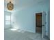 Light blue bedroom with two windows, a closet, and access to a hallway at 4023 Cascades Thrust, Summerville, SC 29483