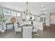 Open concept dining area with a round wooden table and neutral-toned chairs at 4023 Cascades Thrust, Summerville, SC 29483