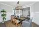 Bright dining room with a wooden table, chandelier, and hardwood floors at 4023 Cascades Thrust, Summerville, SC 29483