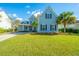 Two-story home with gray siding, landscaping, and a driveway at 4023 Cascades Thrust, Summerville, SC 29483