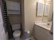 Simple bathroom with a pedestal sink and linen cabinet at 403 Reserve Way, Summerville, SC 29485