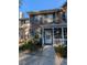 Brick townhouse with front porch and landscaping at 403 Reserve Way, Summerville, SC 29485
