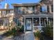 Brick front townhome with porch and landscaping at 403 Reserve Way, Summerville, SC 29485