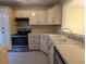 Kitchen with light wood cabinets and stainless steel appliances at 403 Reserve Way, Summerville, SC 29485