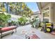 Relaxing backyard patio with lush landscaping and seating area at 404 Claymoor Village Ln, Summerville, SC 29486