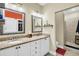 Double vanity bathroom with granite countertop and mirrors at 404 Claymoor Village Ln, Summerville, SC 29486