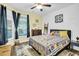 Cozy bedroom with a queen-size bed and large windows at 404 Claymoor Village Ln, Summerville, SC 29486