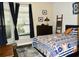 Cozy bedroom with a comfortable bed, large windows, and stylish decor at 404 Claymoor Village Ln, Summerville, SC 29486