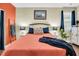 Relaxing bedroom with coral bedding and unique decor at 404 Claymoor Village Ln, Summerville, SC 29486