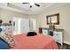 Main bedroom with coral bedding and access to bathroom at 404 Claymoor Village Ln, Summerville, SC 29486