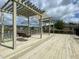 Relaxing community deck with pergola, seating and lake view at 404 Claymoor Village Ln, Summerville, SC 29486