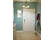 Inviting entryway with light teal walls, tile floors, and a white door at 404 Claymoor Village Ln, Summerville, SC 29486