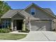 Beautiful two-story house with a stone facade and a two-car garage at 404 Claymoor Village Ln, Summerville, SC 29486