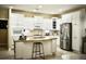 Spacious kitchen with white cabinets, a large island, and stainless steel appliances at 404 Claymoor Village Ln, Summerville, SC 29486