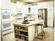 Modern kitchen with white cabinets, granite countertops, and stainless steel appliances at 404 Claymoor Village Ln, Summerville, SC 29486