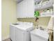Bright laundry room with washer, dryer, and utility sink at 404 Claymoor Village Ln, Summerville, SC 29486