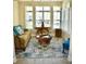 Sun-drenched living area featuring a tan couch and unique coffee table at 404 Claymoor Village Ln, Summerville, SC 29486