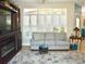 Comfortable living room with a light grey couch and large windows with plantation shutters at 404 Claymoor Village Ln, Summerville, SC 29486