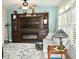 Cozy living room with a large TV, built-in shelving, and fireplace at 404 Claymoor Village Ln, Summerville, SC 29486