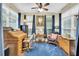 Home office with antique rolltop desk and comfortable chair at 404 Claymoor Village Ln, Summerville, SC 29486