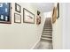 Stairwell with carpeted steps and framed artwork on the walls at 404 Claymoor Village Ln, Summerville, SC 29486
