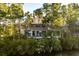 Luxury home with pool and private backyard surrounded by trees at 415 Estuary Ln, Kiawah Island, SC 29455