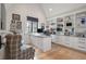 Bright home office featuring built-in shelving and a spacious desk at 415 Estuary Ln, Kiawah Island, SC 29455