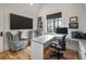 L-shaped desk with built-in shelving and comfortable armchairs at 415 Estuary Ln, Kiawah Island, SC 29455