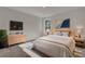 Cozy bedroom with wood bed frame and neutral decor at 5629 Ellington School Rd, Ravenel, SC 29470