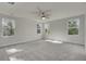 Bright bedroom with ceiling fan and ample natural light at 5629 Ellington School Rd, Ravenel, SC 29470
