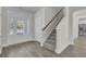 Bright entryway with hardwood floors and staircase at 5629 Ellington School Rd, Ravenel, SC 29470