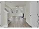 Spacious entryway with hardwood floors leading to a living room at 5629 Ellington School Rd, Ravenel, SC 29470