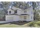 Two-story white house with black shutters, gray roof, and a two-car garage at 5629 Ellington School Rd, Ravenel, SC 29470