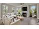 Living room with hardwood floors, a fireplace, and comfortable seating at 5629 Ellington School Rd, Ravenel, SC 29470