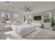 Spacious main bedroom with large windows and neutral decor at 5629 Ellington School Rd, Ravenel, SC 29470