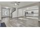 Open concept floorplan with kitchen, living area, and stairs at 5629 Ellington School Rd, Ravenel, SC 29470